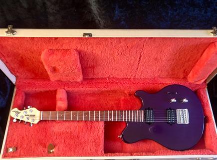 1990's Musicman Axis sport, finished in rtansluscent purple over a solid ash bod